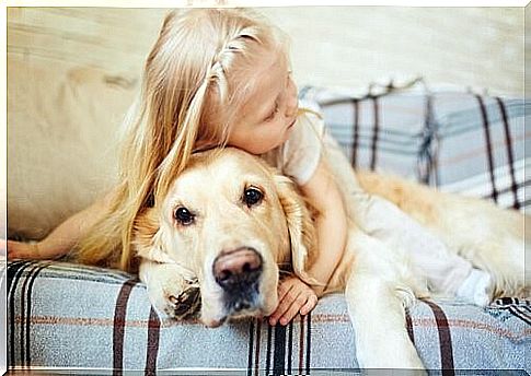 Things Your Dog Doesn't Like - Little Girl Hugs Dog